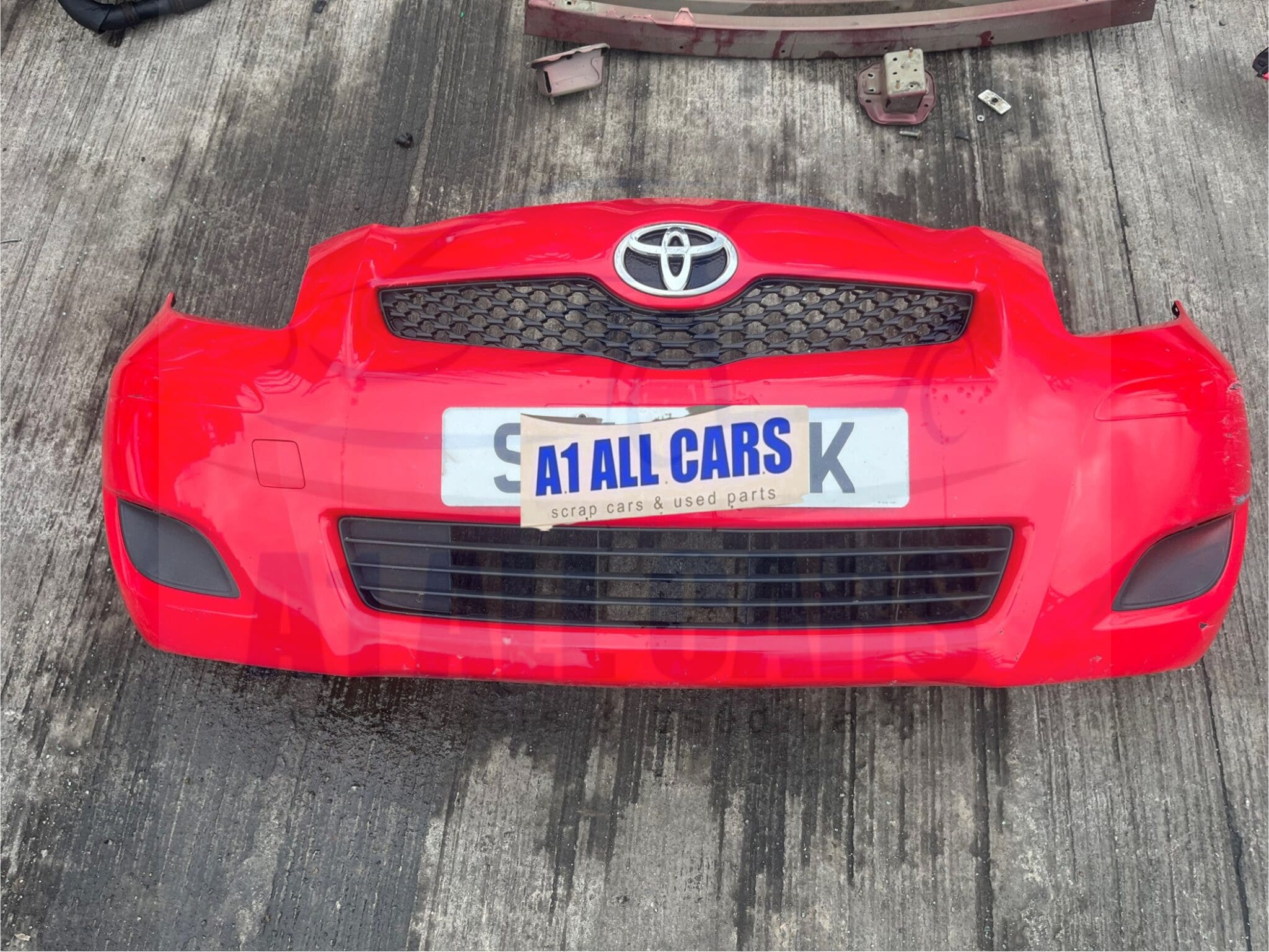 Toyota Yaris 2009-2011 Front Bumper – Red 3P0 Colour Code ( Small Scratch See Pics )